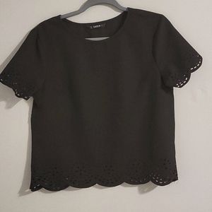 Simple black blouse with accents on sleeves and bottom